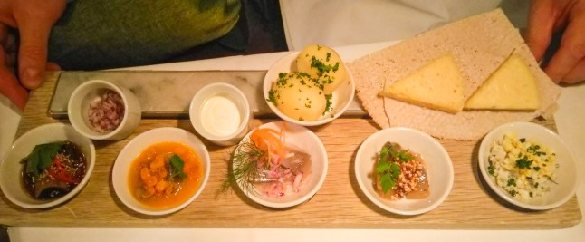 Platter of pickled Herring with Vasterbotten Cheese and condiments