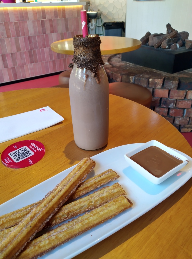 Classic Churros and Milk Chocolate Sauce accompanied with a Cookies and Cream Milk Shake